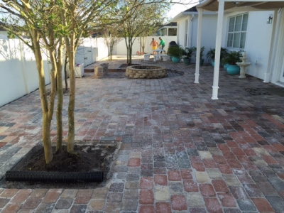Large back stone patio with landscaping